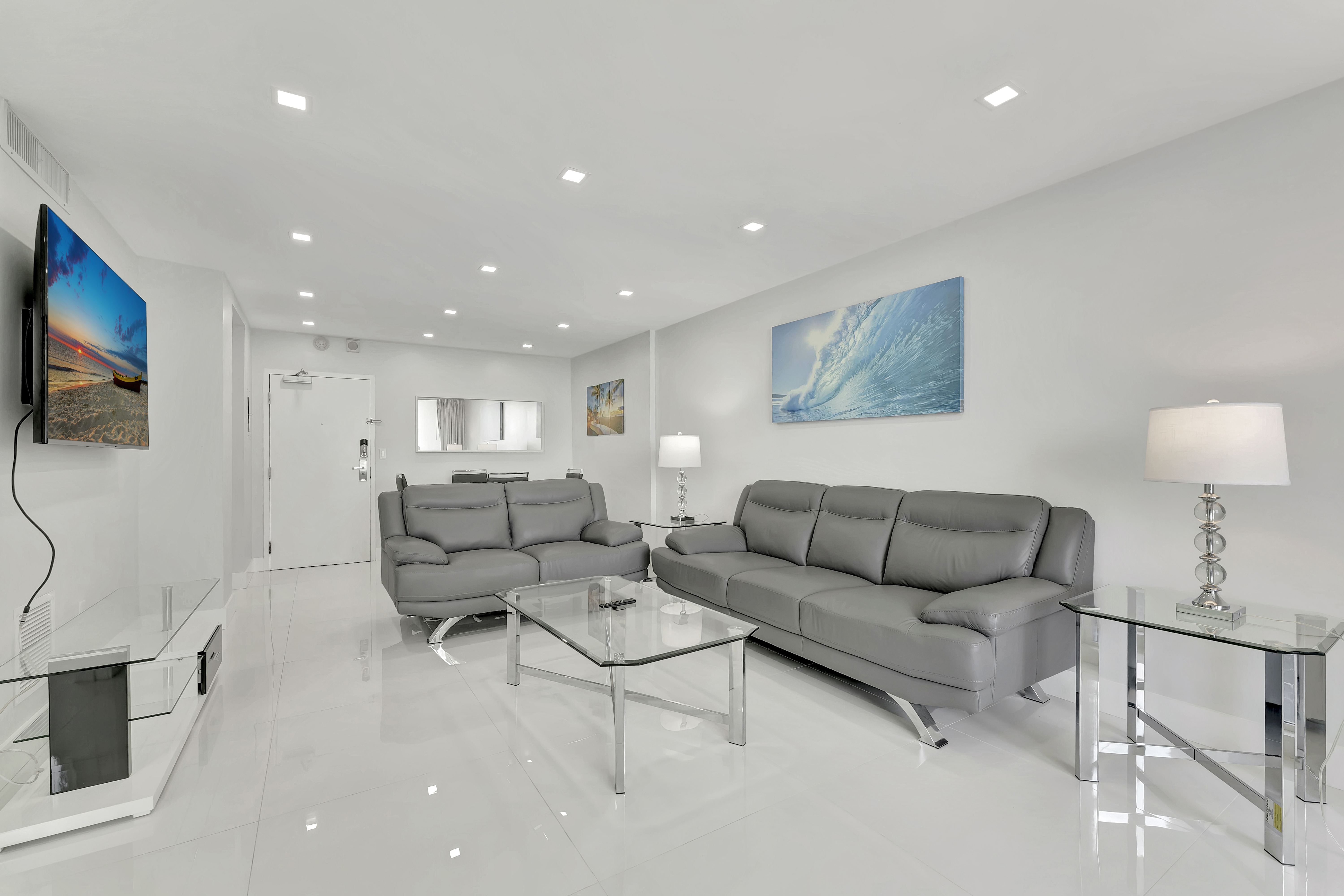 1 Bedroom Suite living room with direct balcony access and ocean views