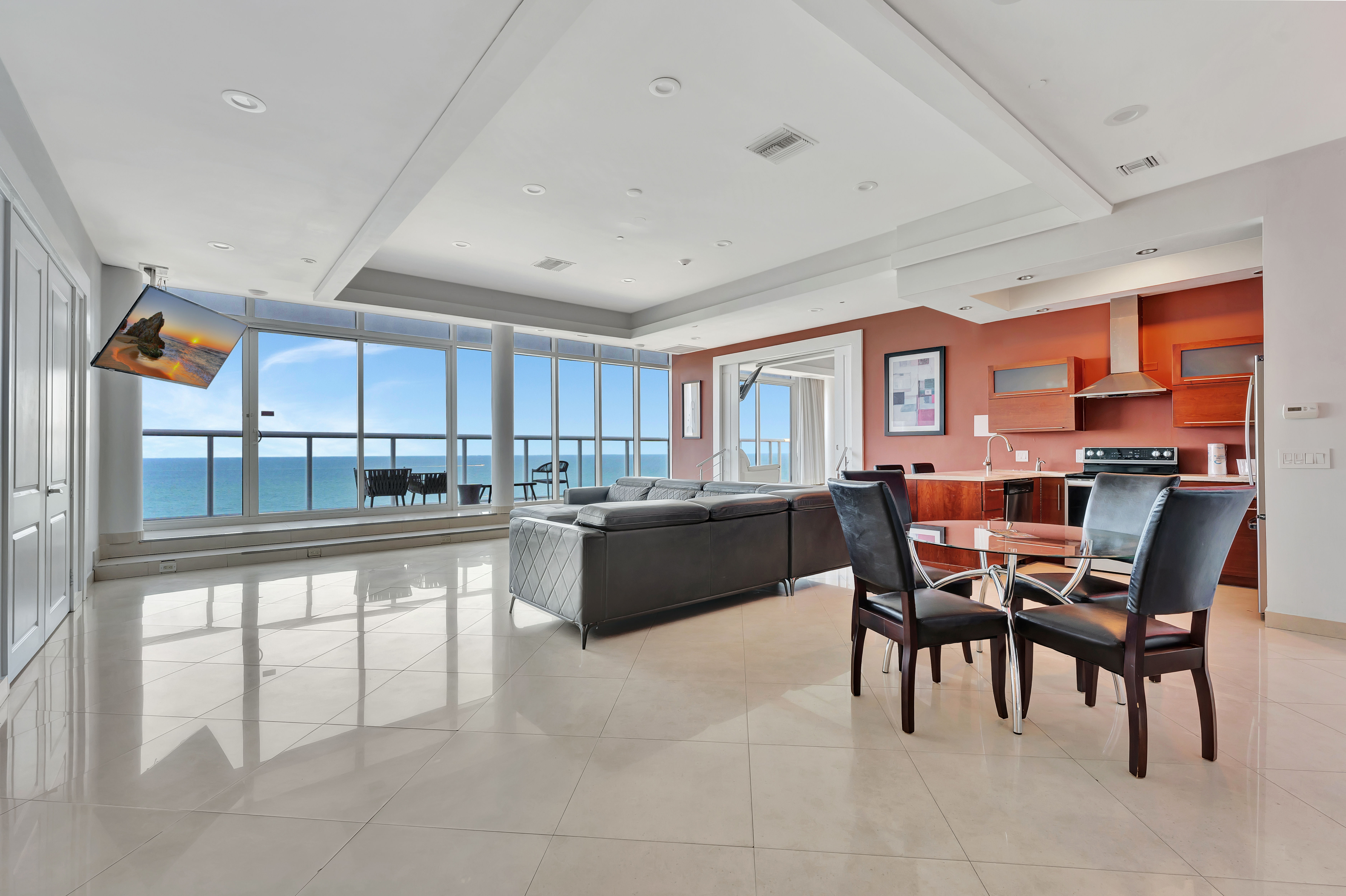 Open Concept Living Room and Kitchen in Ocean Manor Penthouse 1002 with Panoramic Ocean Views