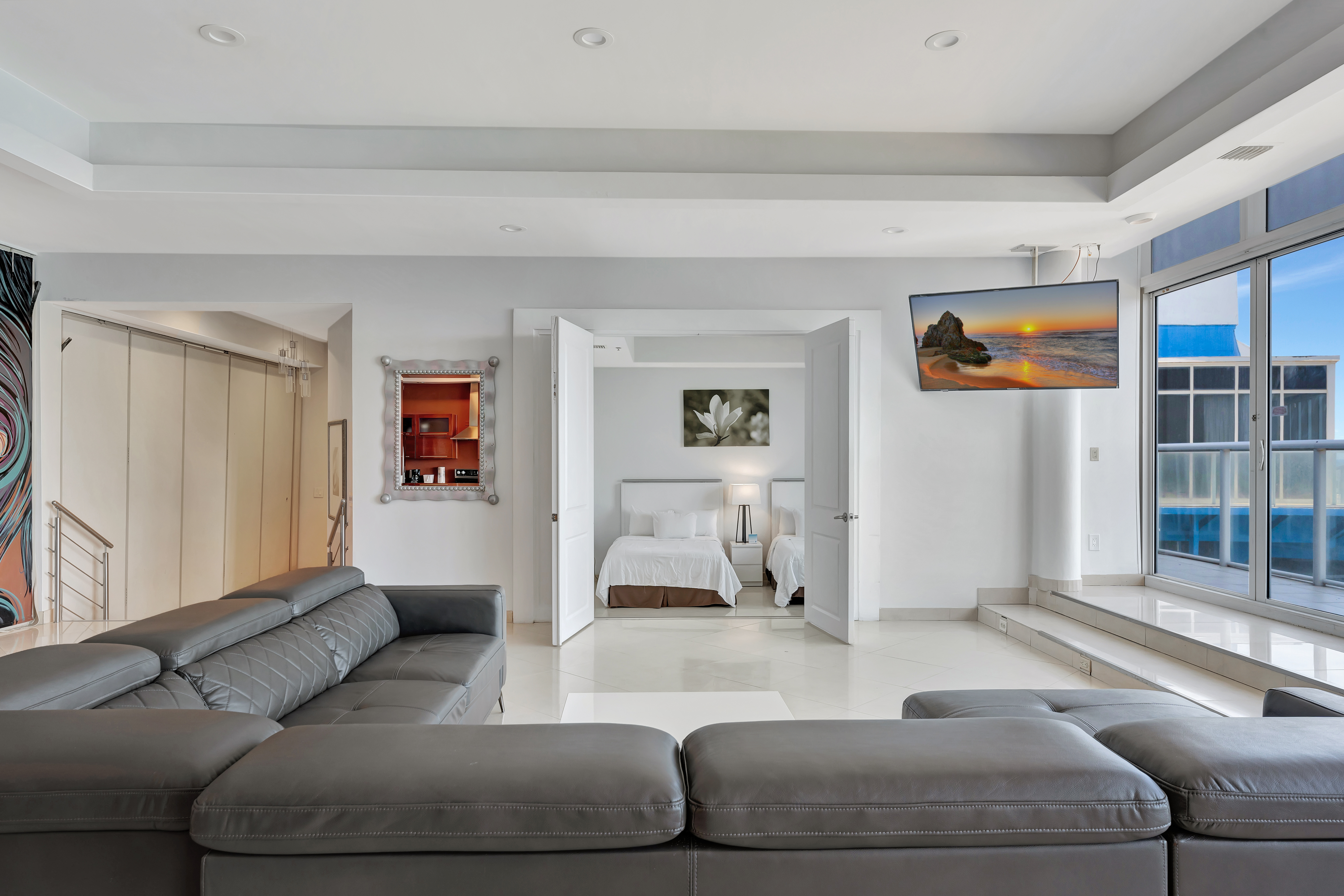 View from the Living Room into a Twin Bedroom at Ocean Manor Penthouse 1002 with Balcony Access