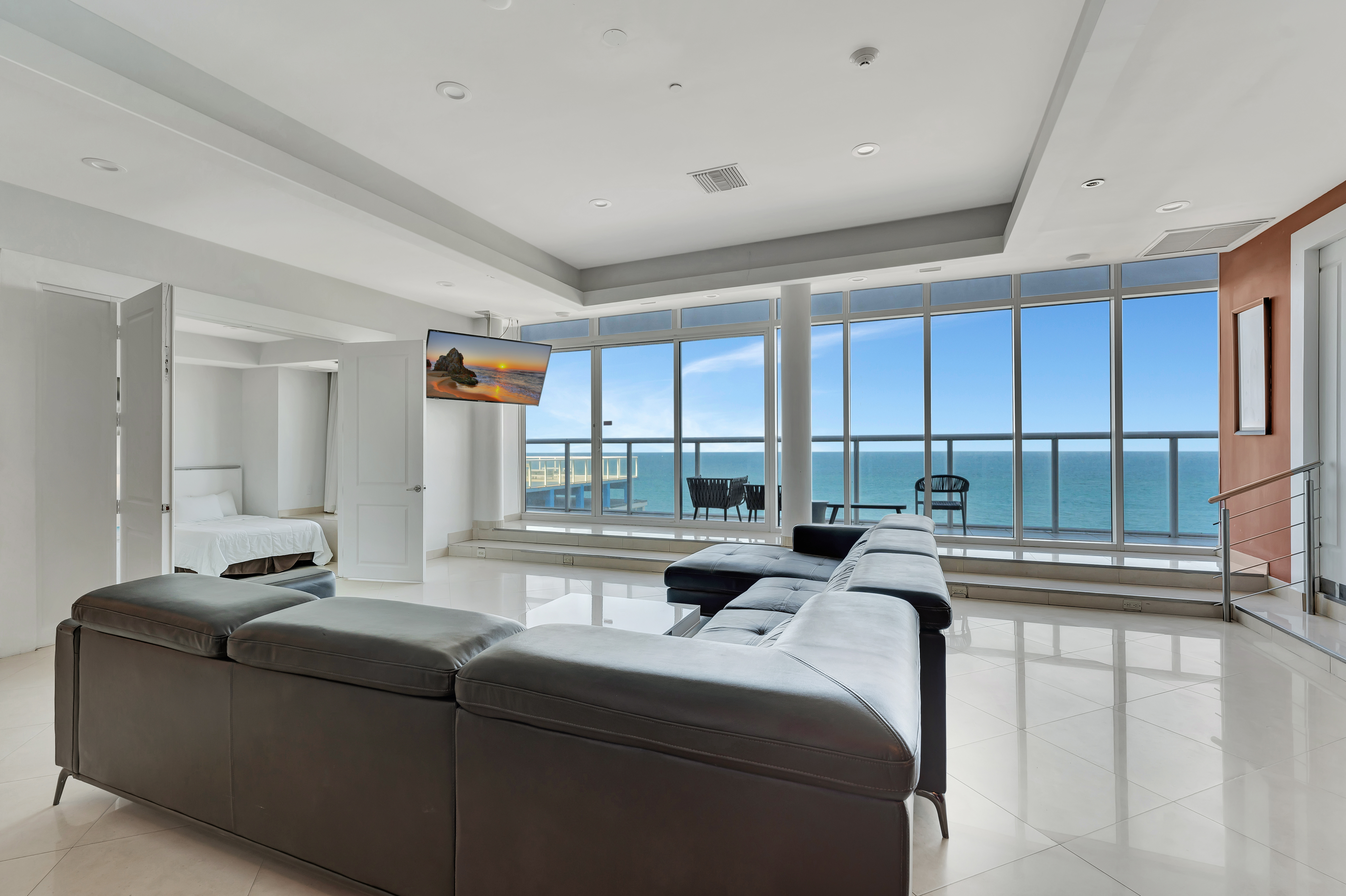 Spacious oceanfront living room with terrace in Penthouse 1102 at Ocean Manor Beach Resort