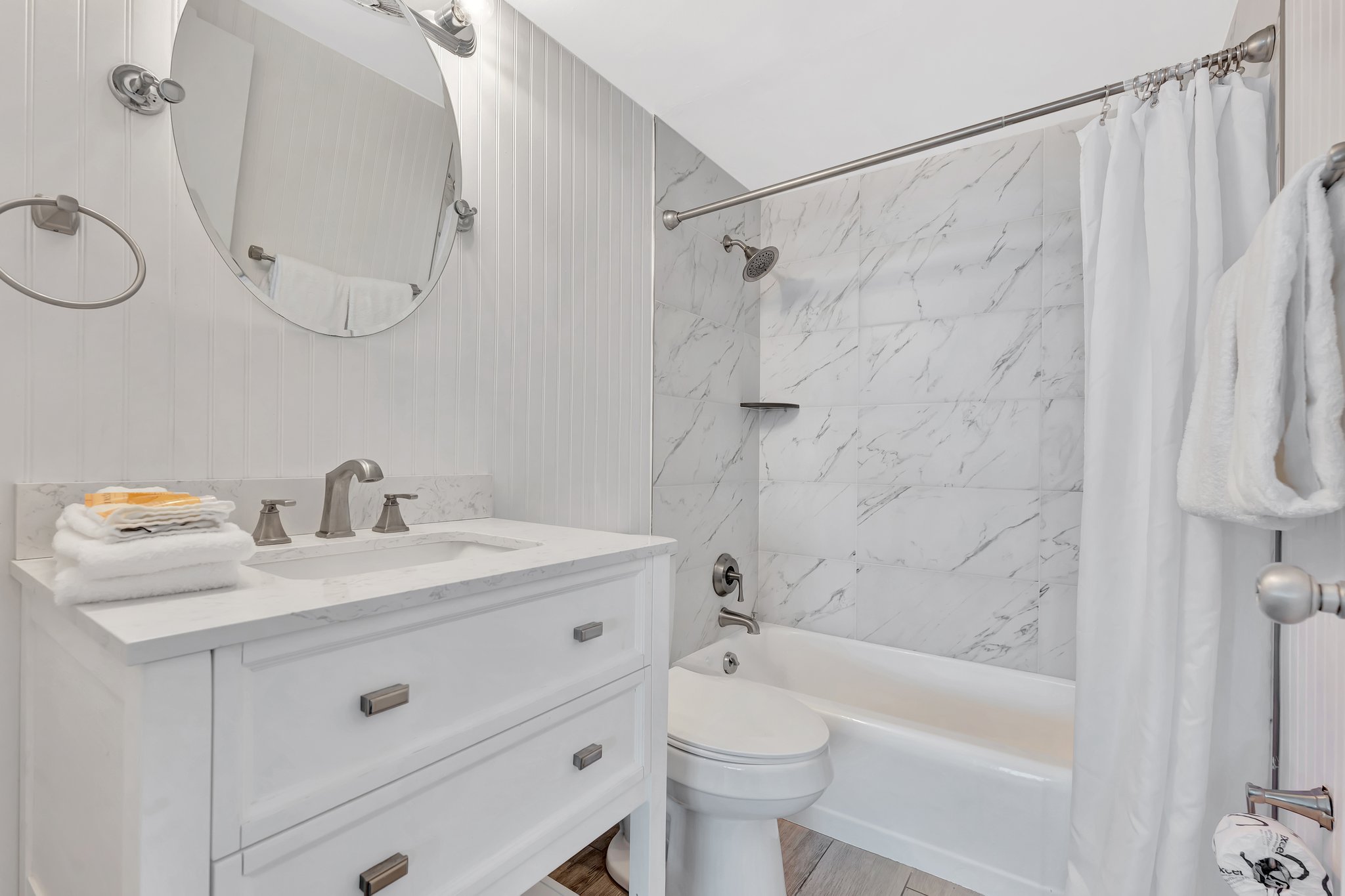 2 Bedroom Suite premium bathroom with white marble finishes and sophisticated design
