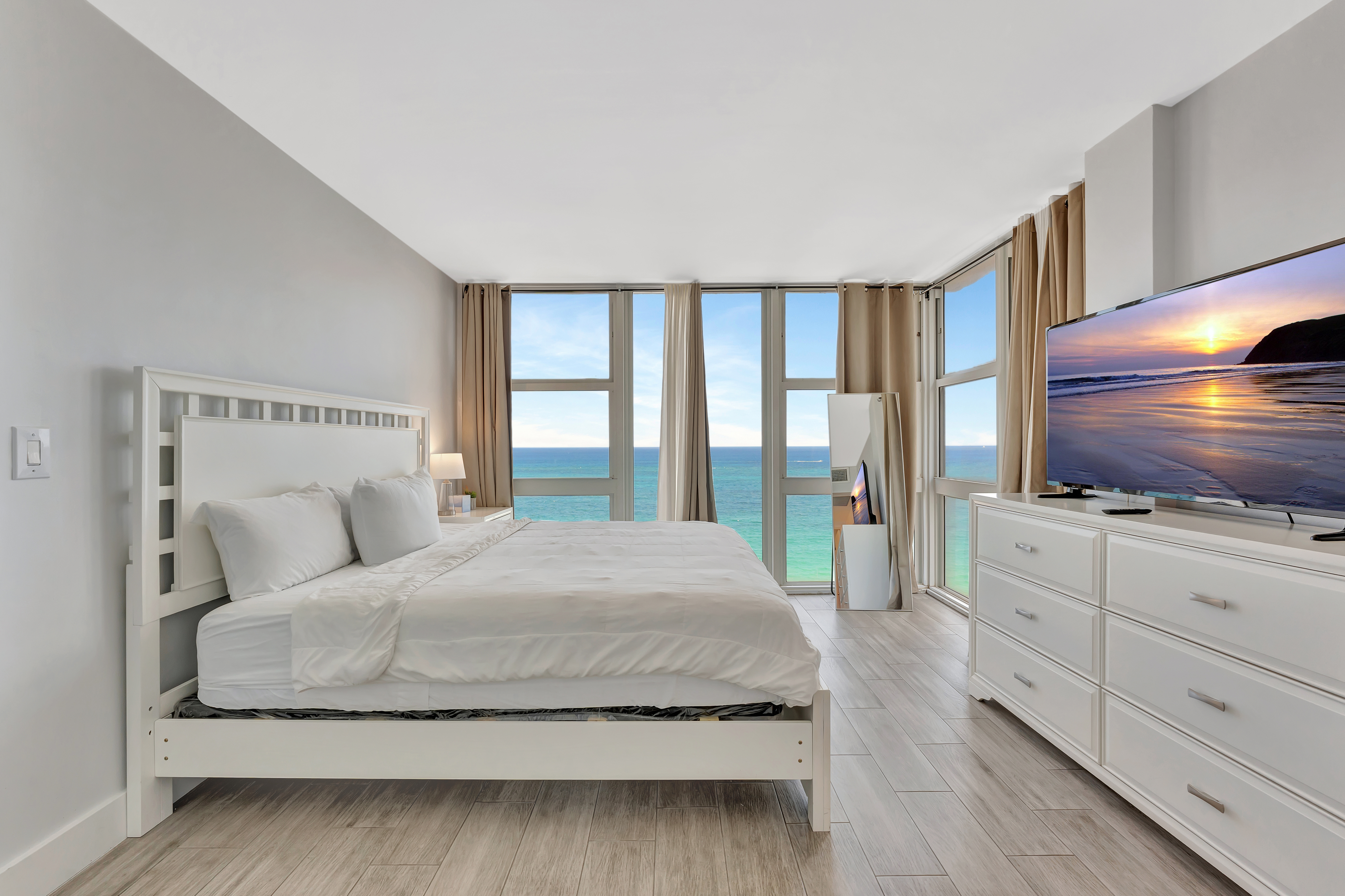 2 Bedroom Suite elegant dining area with ocean views and modern table setting at Ocean Manor Beach Resort
