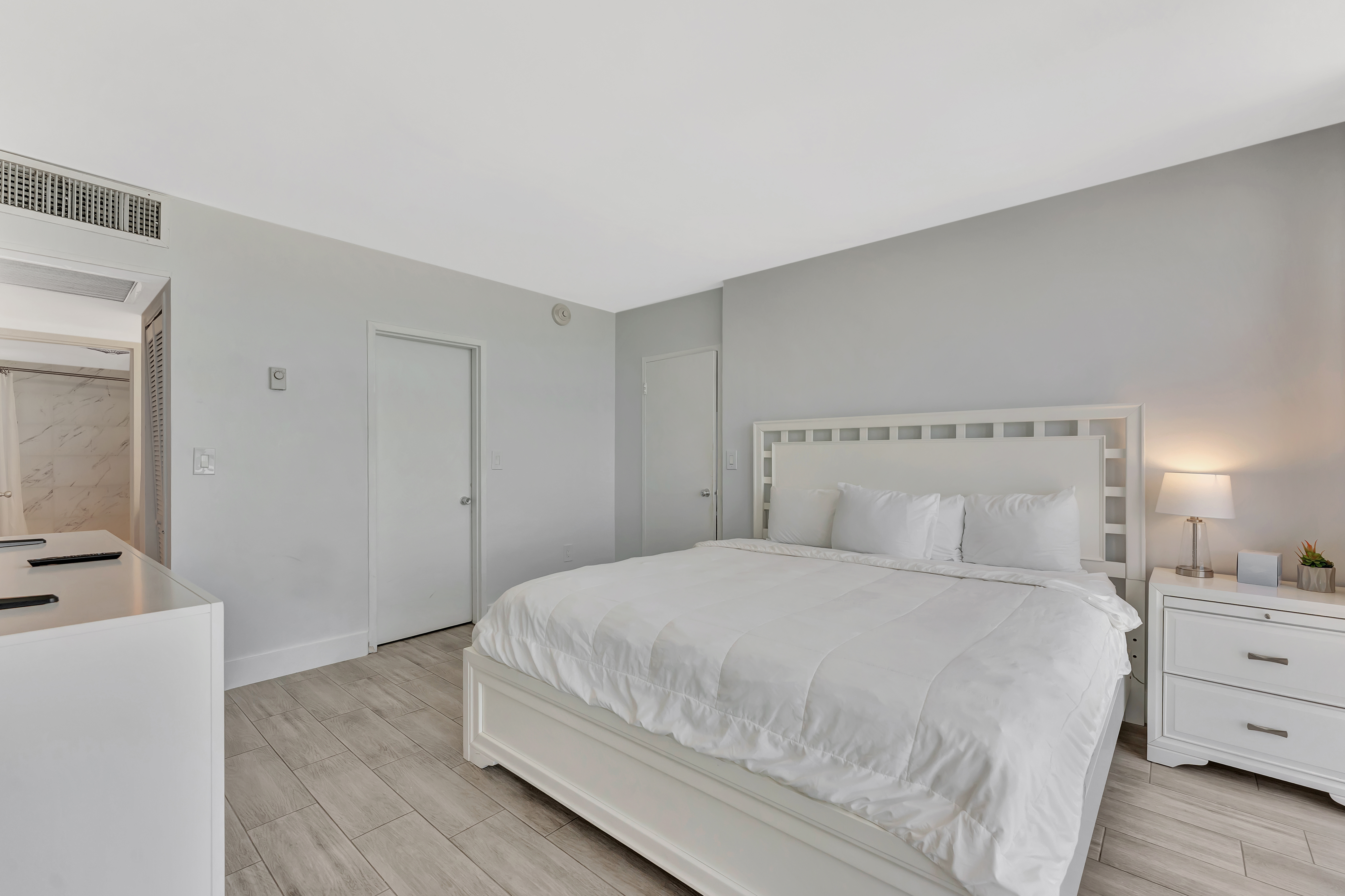 2 Bedroom Suite living area with entertainment center and stunning oceanfront views at Ocean Manor Beach Resort