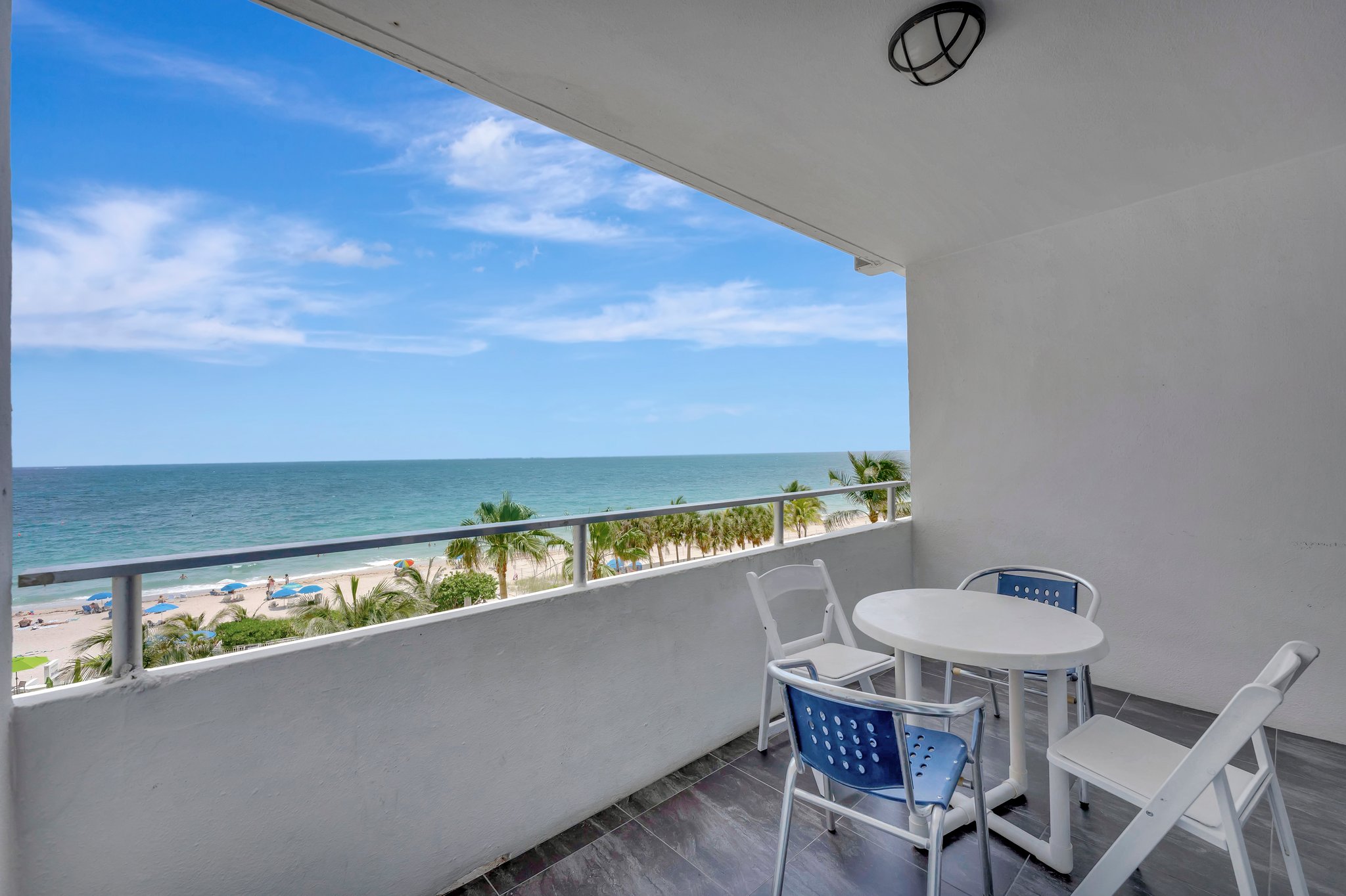 Terrace desk area with chairs and ocean view