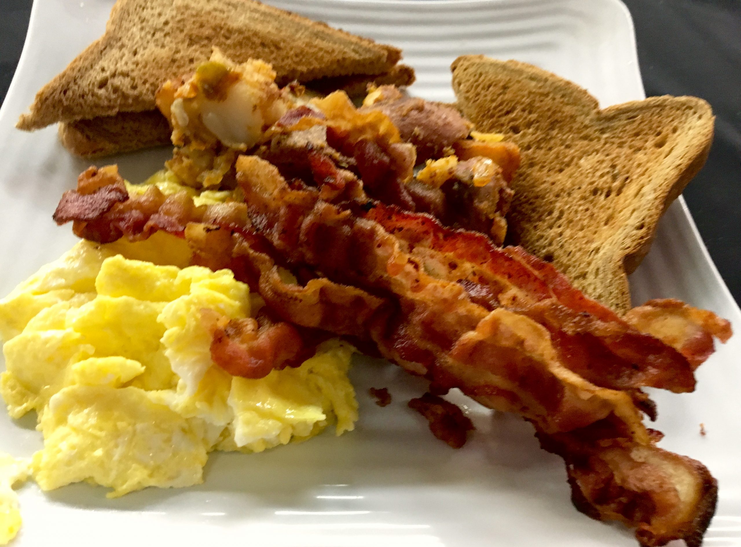 Vegetable omelette with toast and breakfast potatoes
