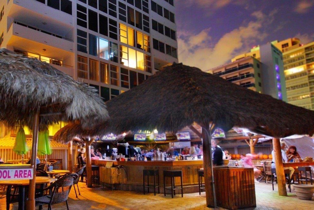Nighttime tiki bar ambiance with tropical lighting at Ocean Manor