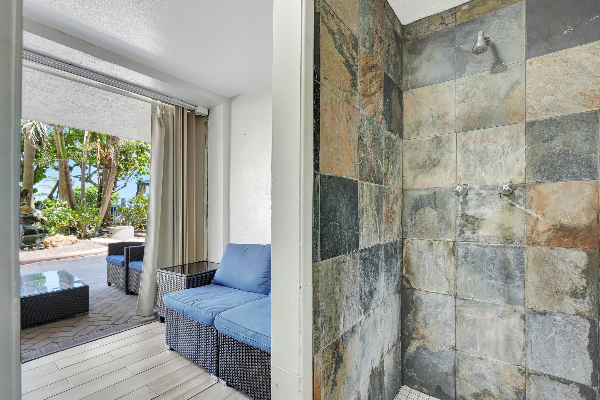 Entrance to beachfront cabana with tropical plants at Ocean Manor