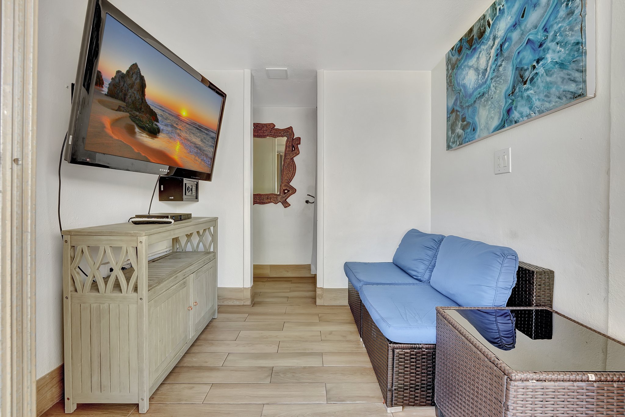 Interior lounge with TV inside private cabana at Ocean Manor Fort Lauderdale