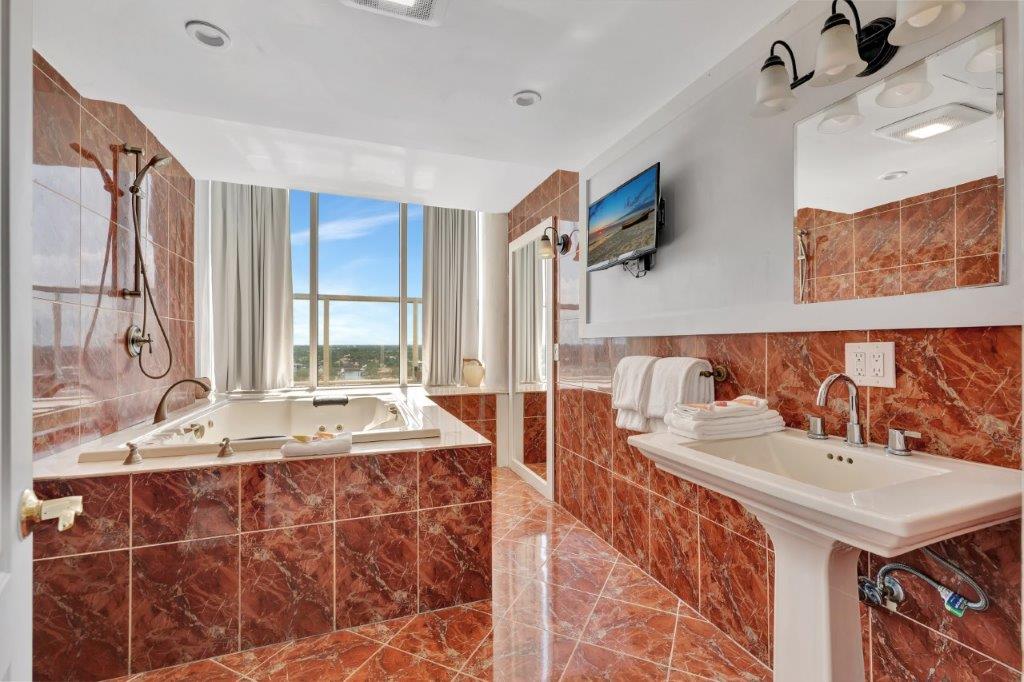 Penthouse 1104 modern walk-in shower with glass enclosure