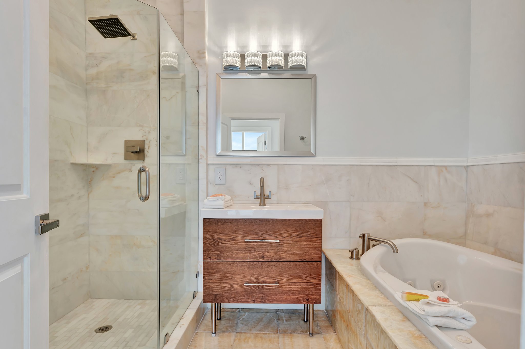 Elegant bathroom with marble finishes at 1005 Penthouse