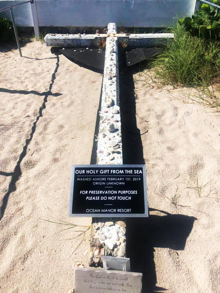 Preservation plaque at the Miracle Cross reading 'Washed ashore February 1, 2019 — origin unknown'