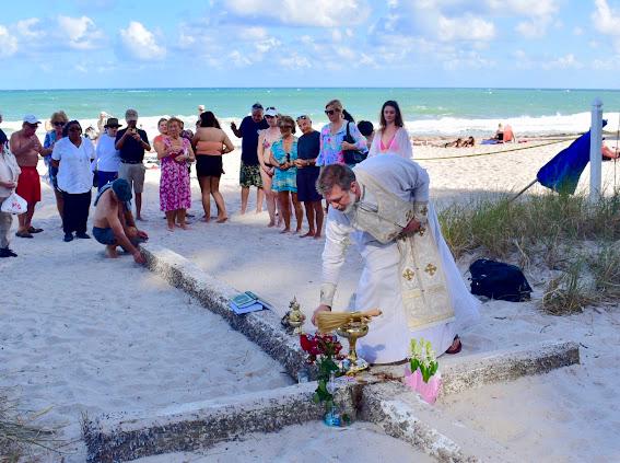 Flowers and ceremonial items placed at the Miracle Cross