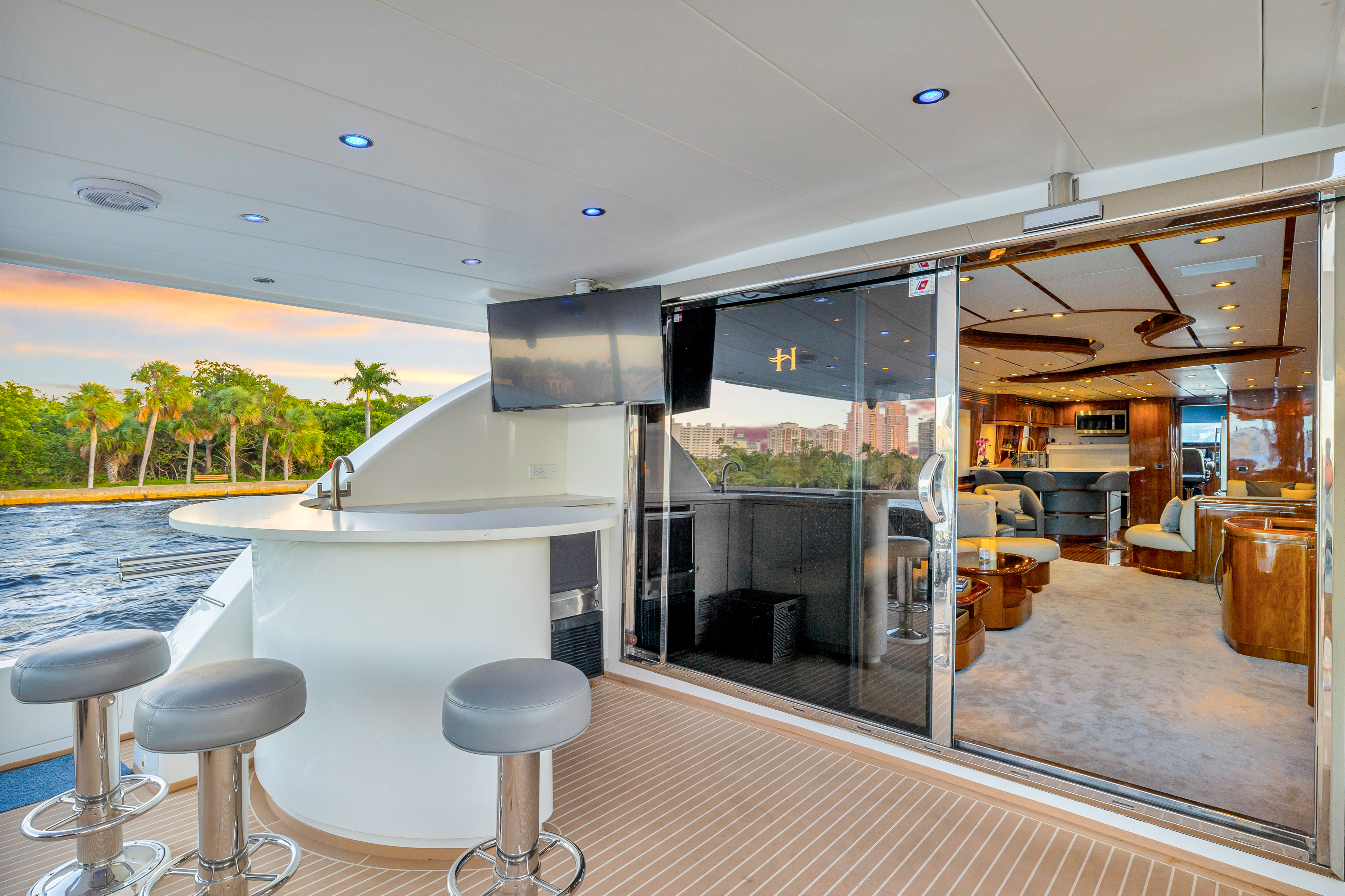Open-air deck bar aboard the Dream On yacht with lounge seating