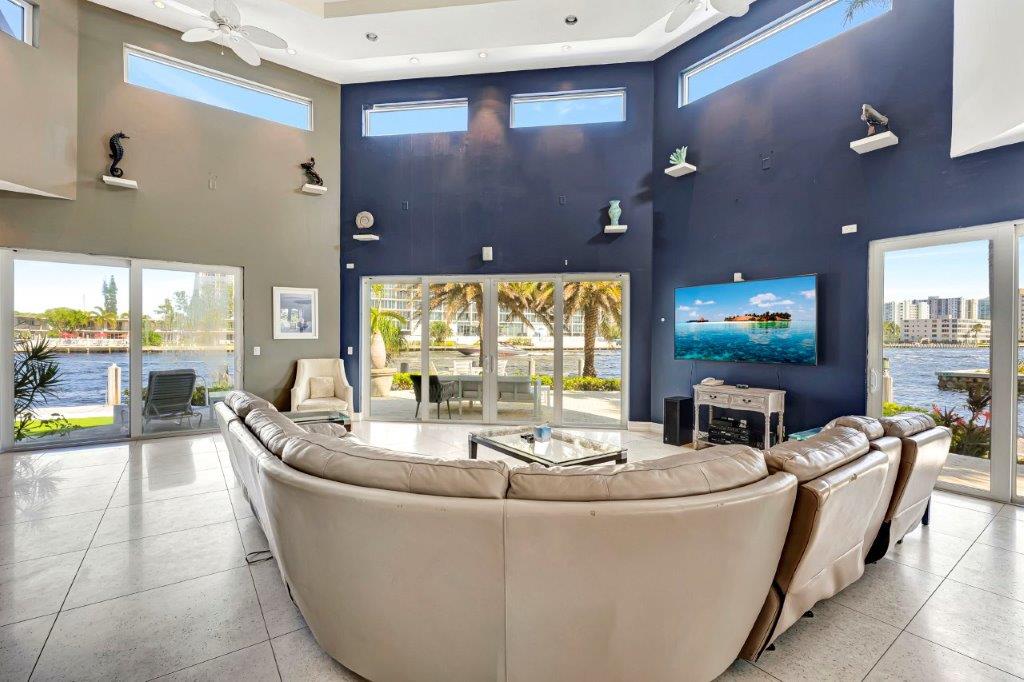 Waterfront living room at 2870 NE 9th Street Pompano Beach luxury mansion with panoramic canal views