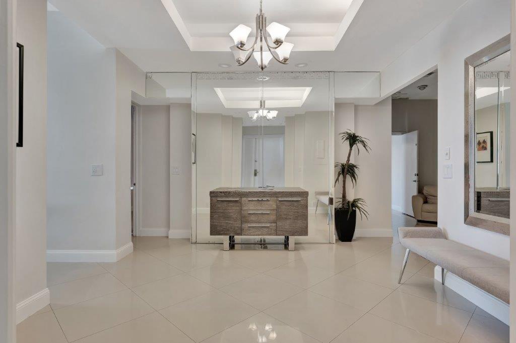 Elegant hallway with mirror wall and contemporary decor