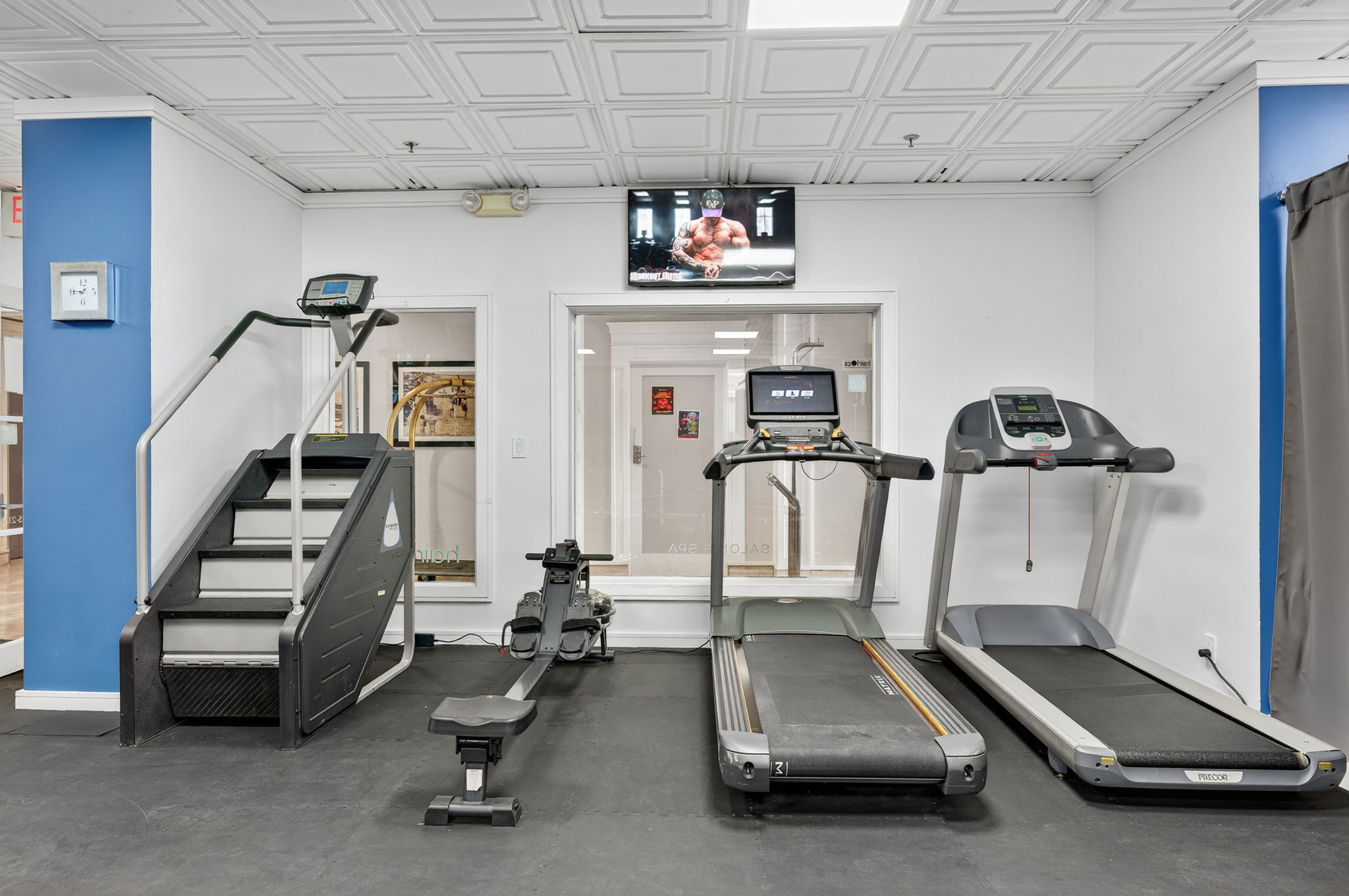 Cardio zone with treadmills and rowing machine at Ocean Manor hotel gym