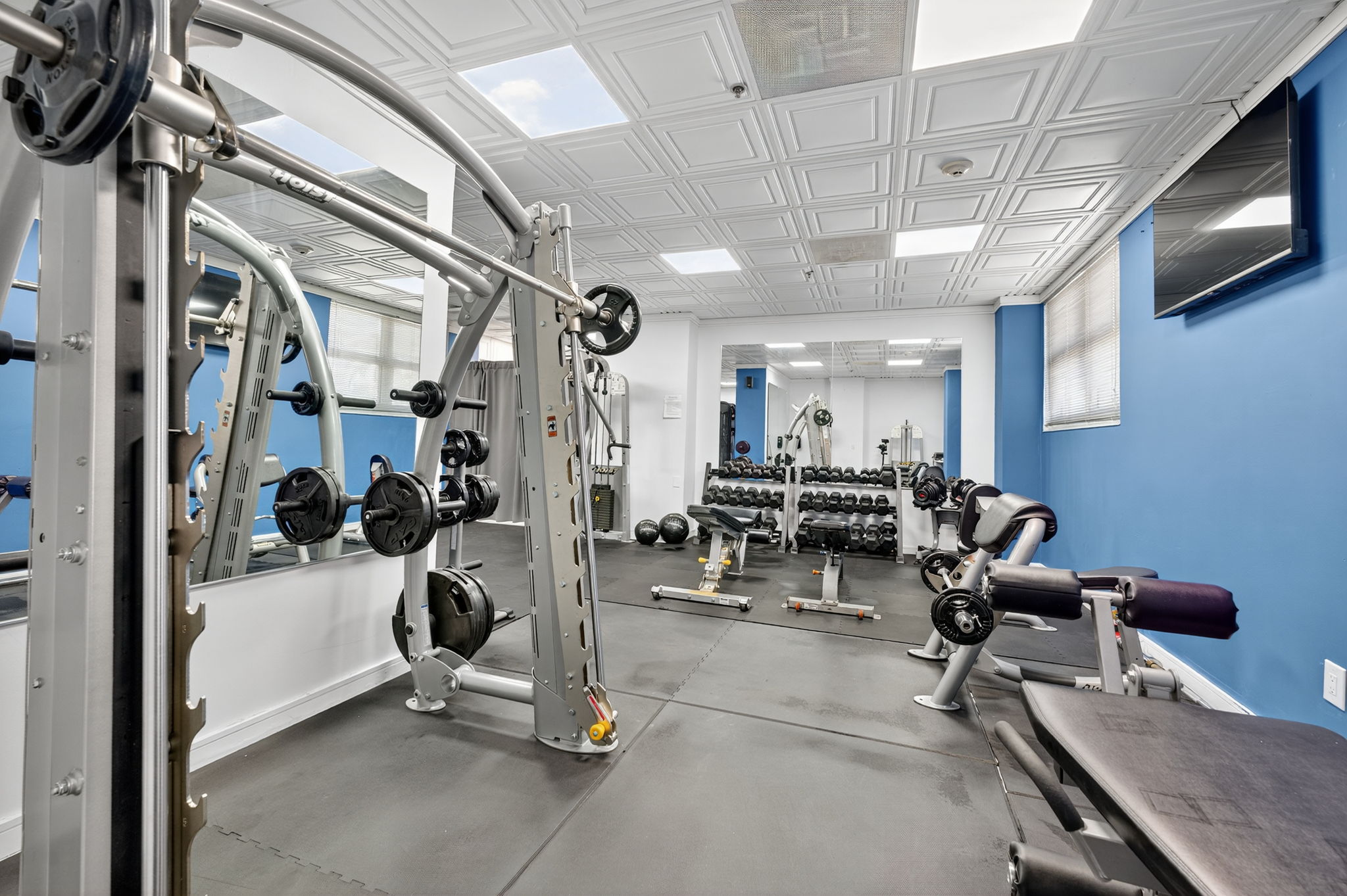 Dumbbell rack and workout area at Ocean Manor hotel gym
