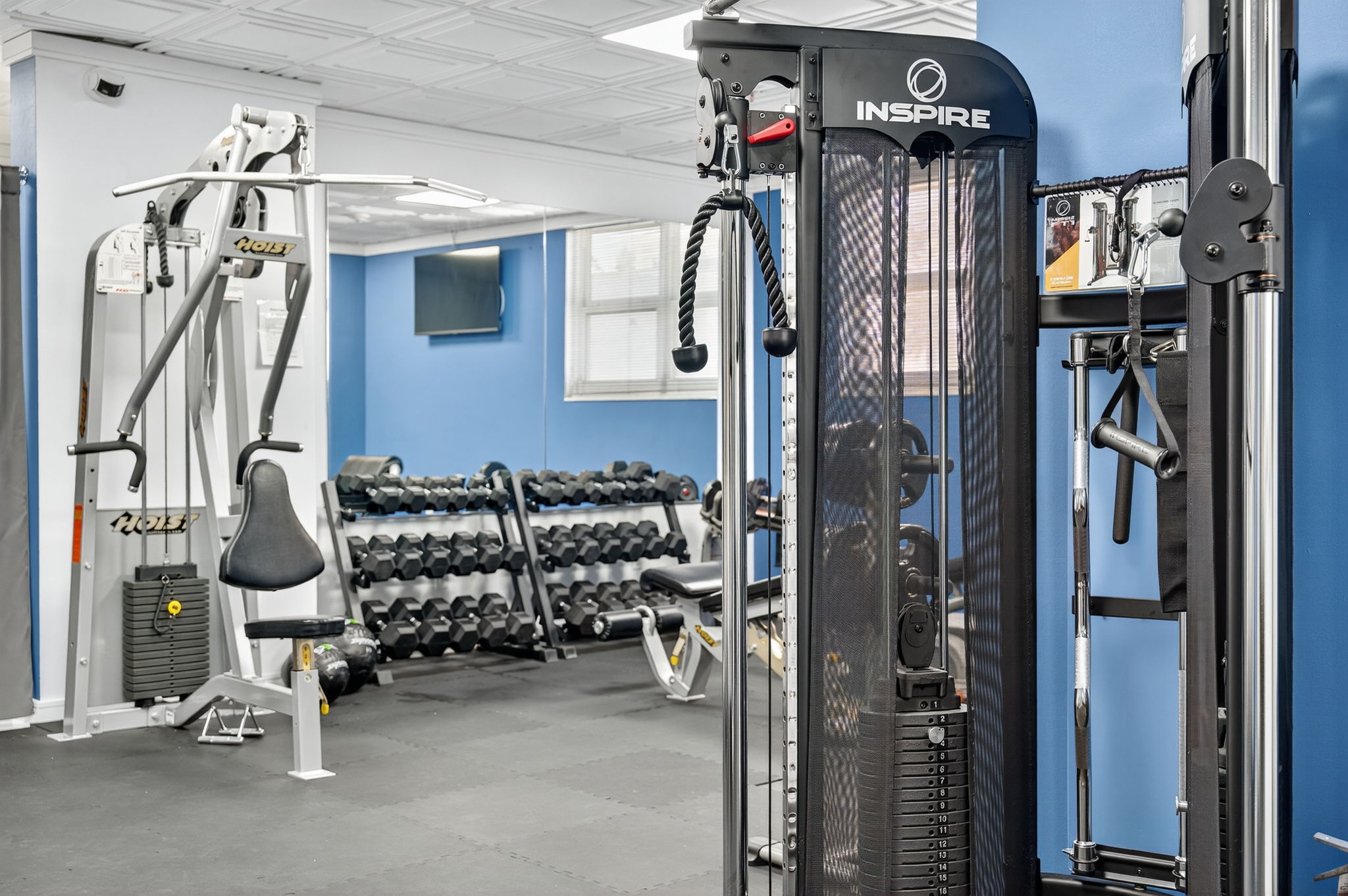 Multi-station cable machine and dumbbells at Ocean Manor hotel gym