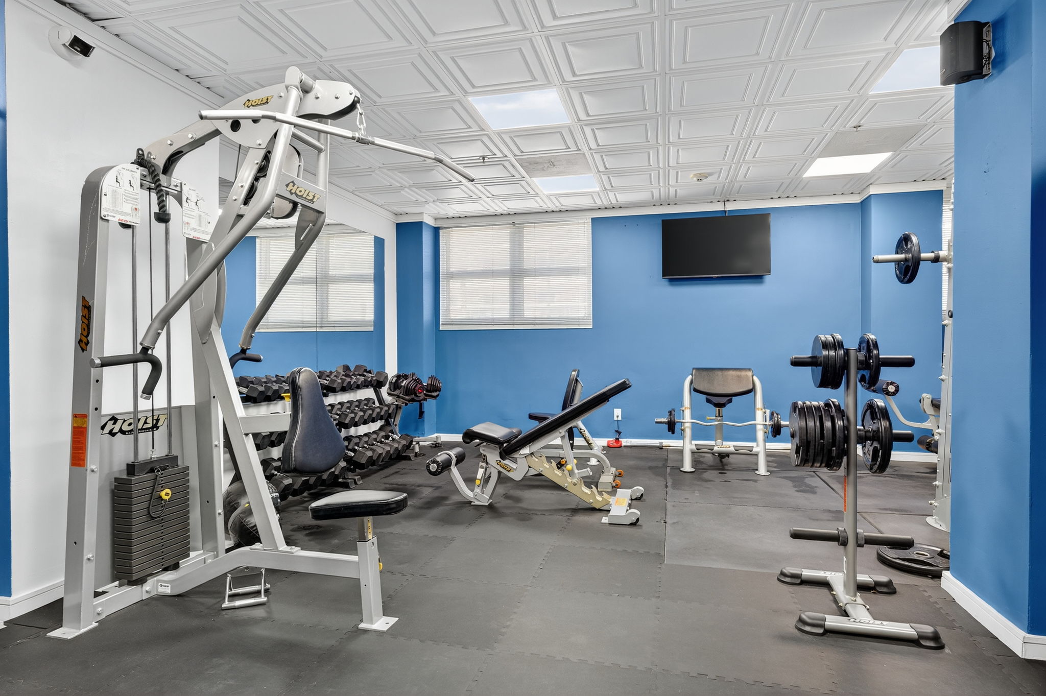 Strength training area with free weights at Ocean Manor hotel gym
