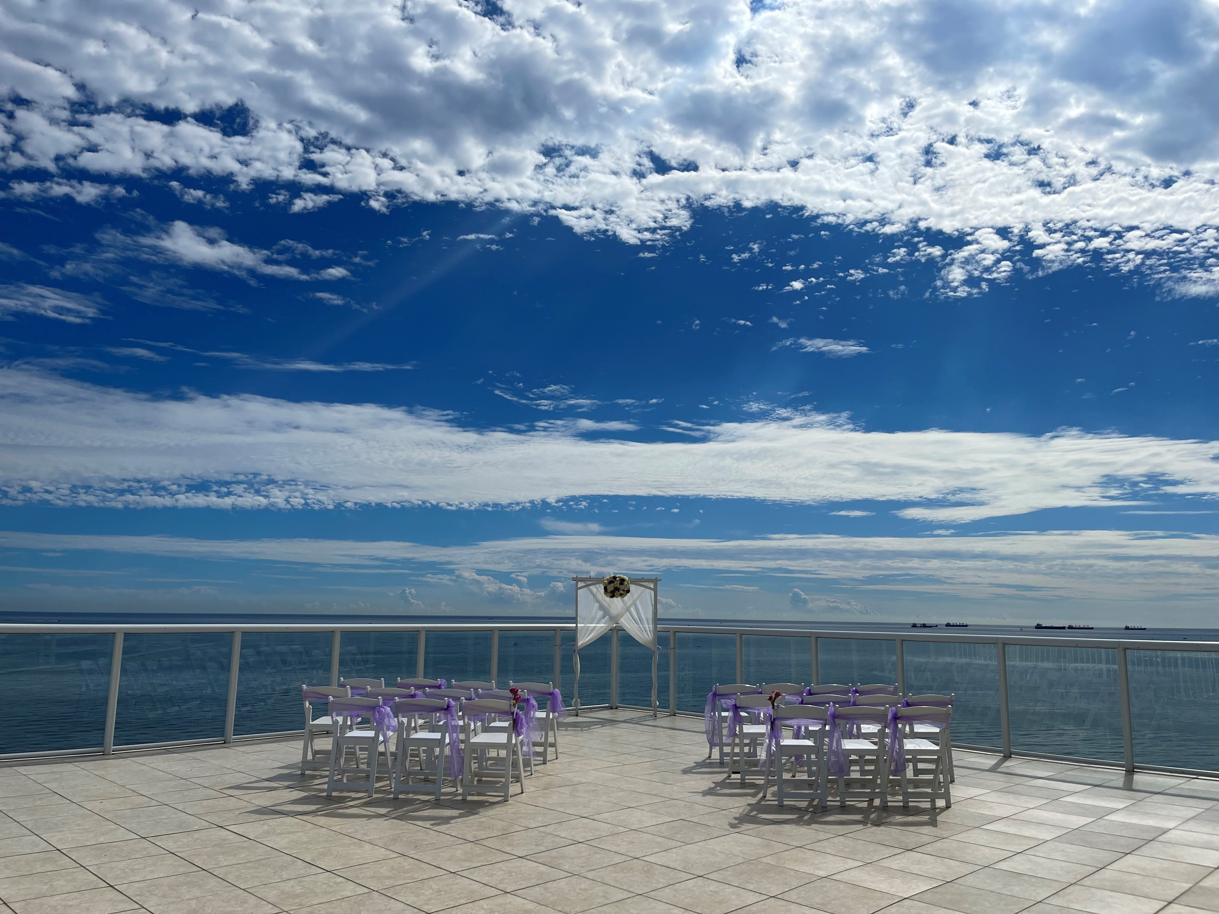 Sky terrace ceremony with ballroom reception access at Ocean Manor